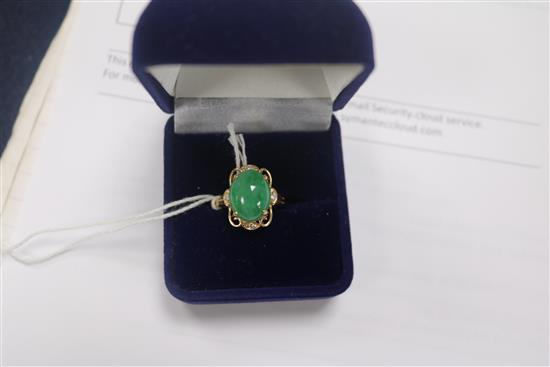 A 14ct gold jade and diamond set dress ring, size O.